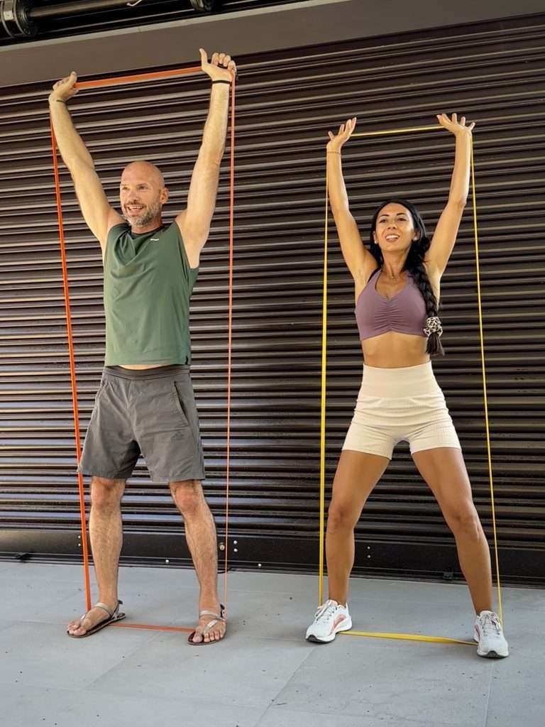 Ketty & Markus working out with elastic bands, 5-day holistic fitness email course