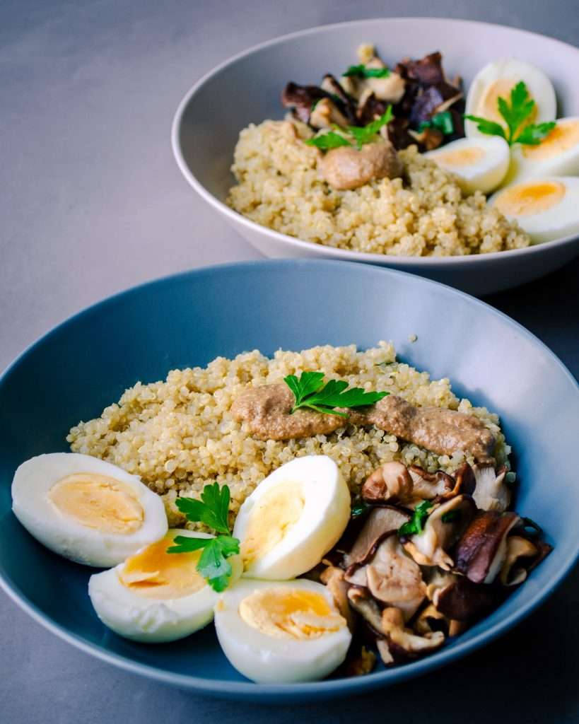The Hidden Cost of Sitting All Day 1 Two plates of a Mediterranean inspired lunch with Quinoa, Shiitake, and Eggs + a drizzle of EVO Oil
